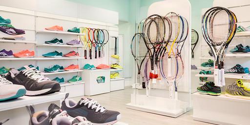 Bright first sports shop in Lake Victoria Gardens with running shoes and tennis racquets on display